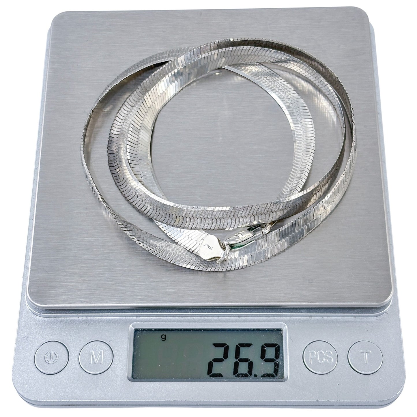 Digital kitchen scale with a silver ring on the platform, displaying a weight of 269 grams.