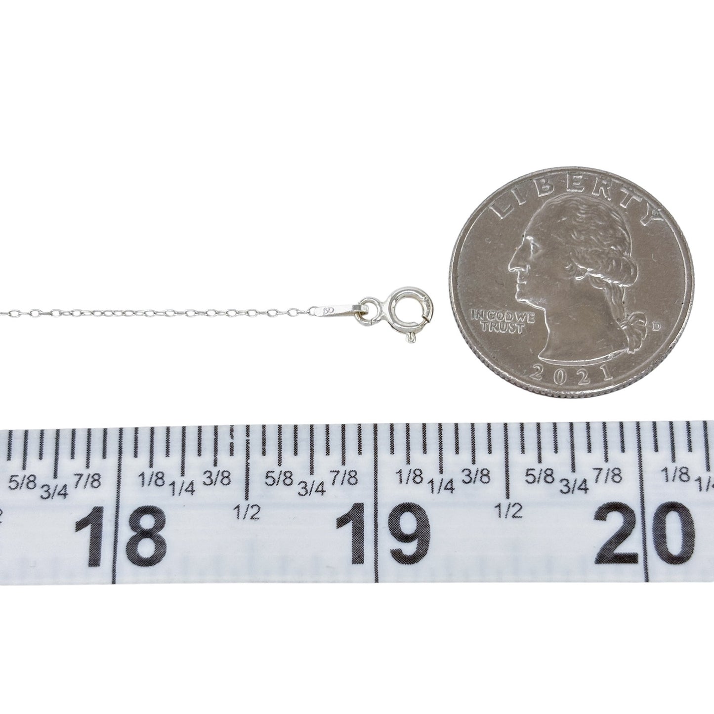 Silver necklace with clasp and chain length measurement against a quarter and ruler.