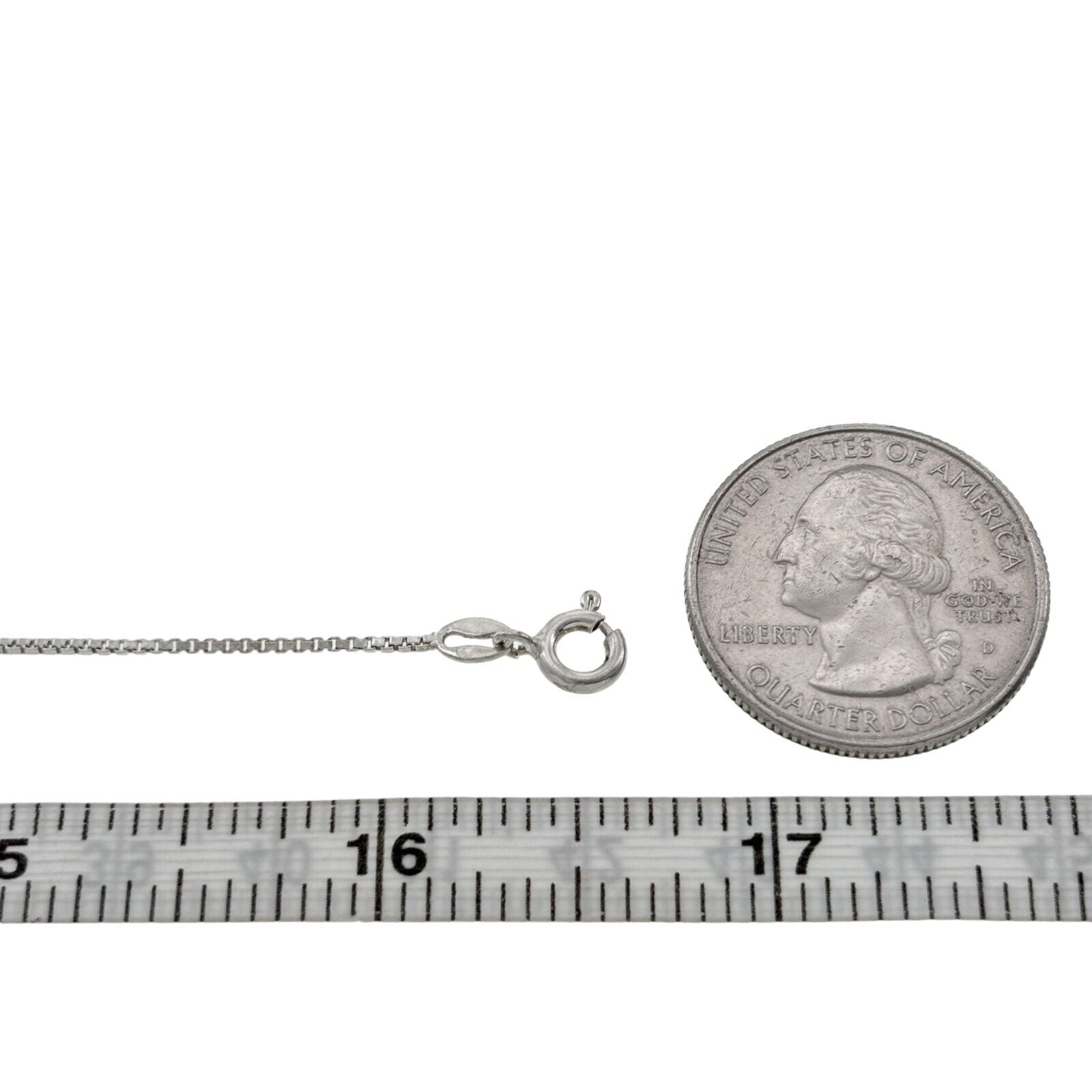 chain with quarter for size against a white background
