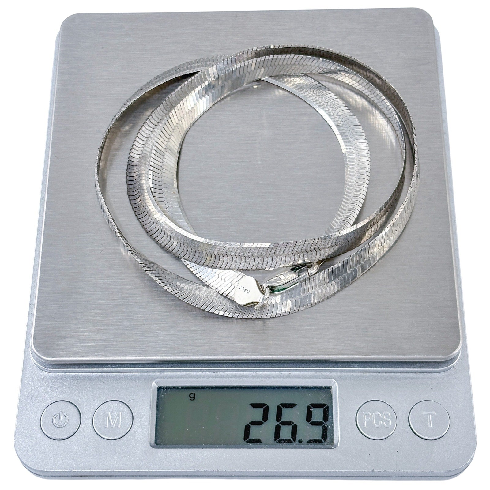 Digital kitchen scale with a silver ring on the platform, displaying a weight of 269 grams.