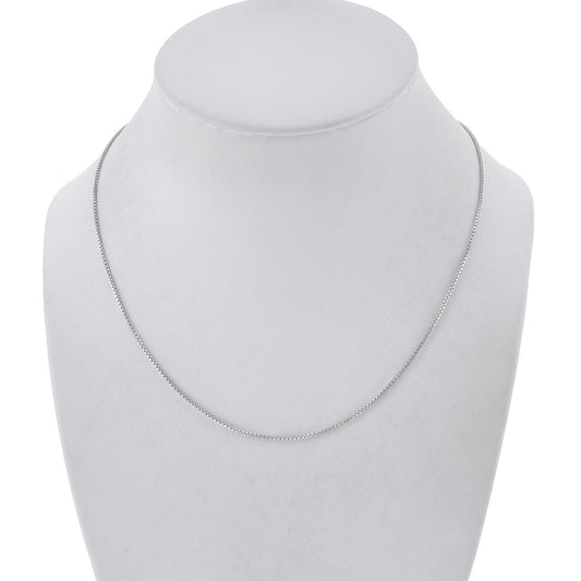 Silver necklace on a mannequin bust against a white background