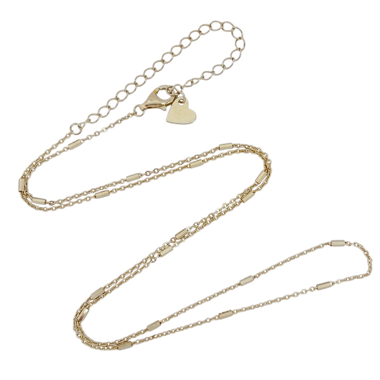 Gold chain necklace on a white background