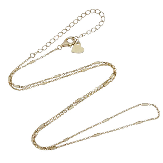 Gold chain necklace on a white background