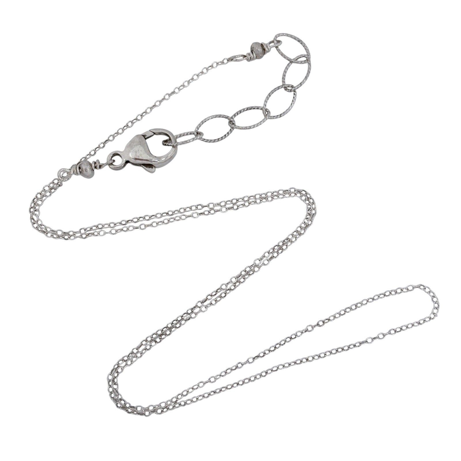 Silver chain necklace on a white background